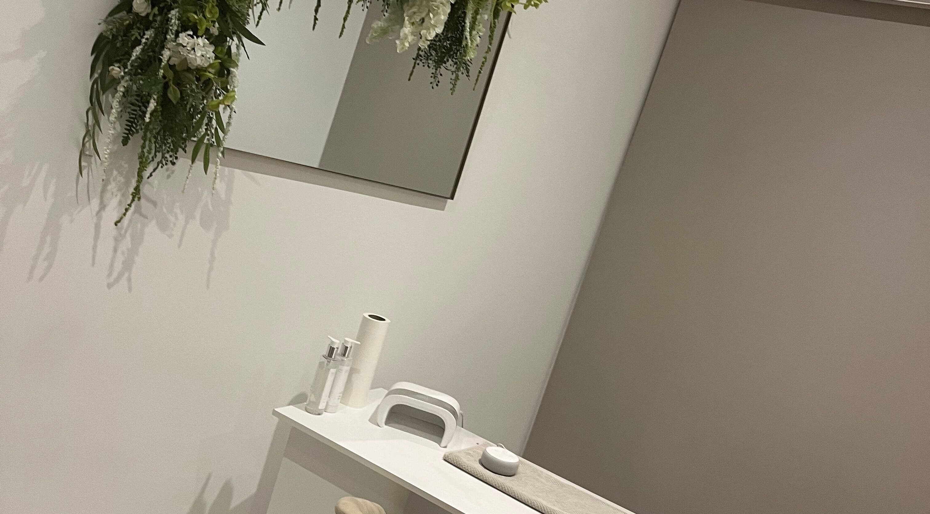 Tranquil beauty treatment space at Rebekah Young Beauty, Elgin, Scotland, GB with plush decor and floral accents.