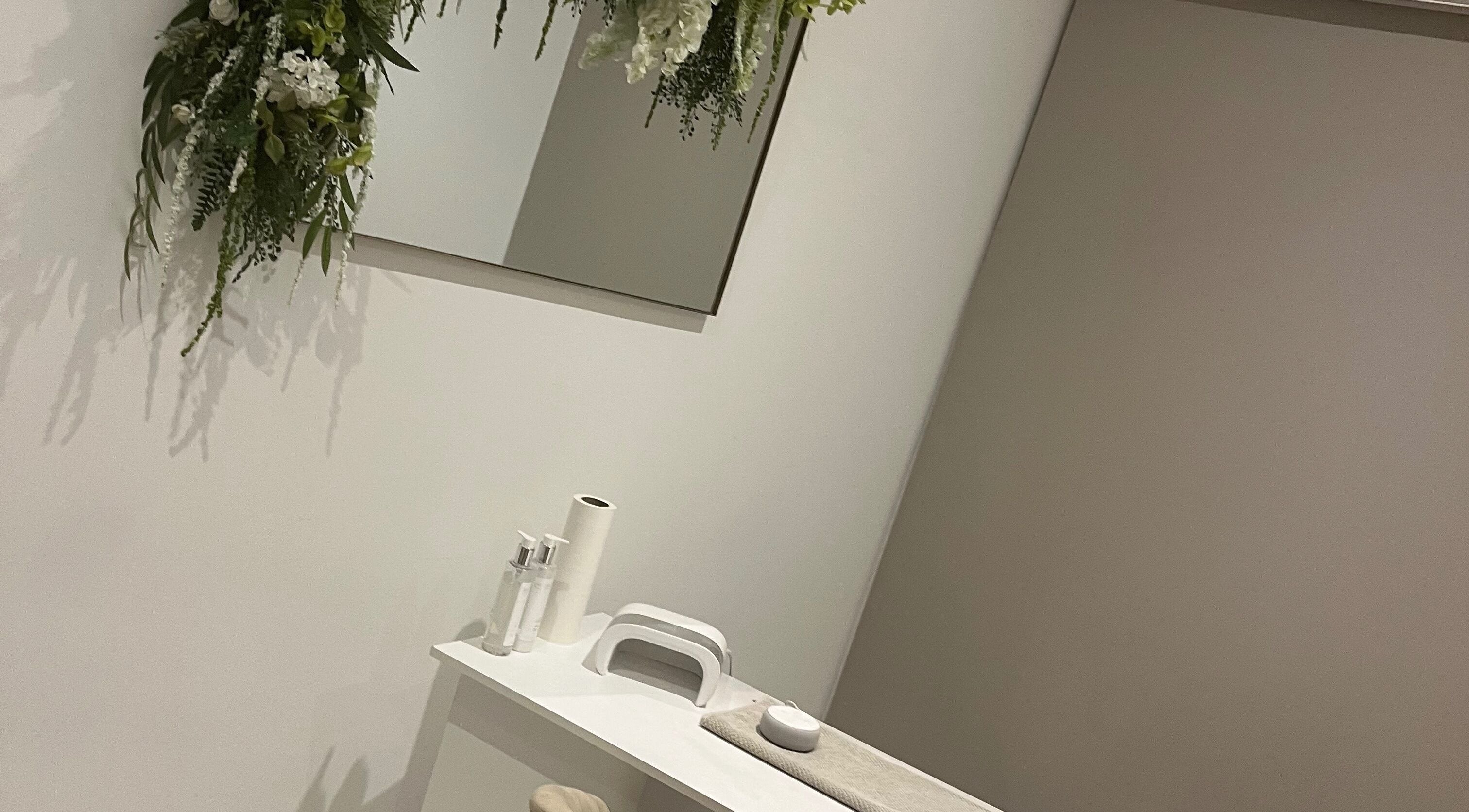 Tranquil beauty treatment space at Rebekah Young Beauty, Elgin, Scotland, GB with plush decor and floral accents.