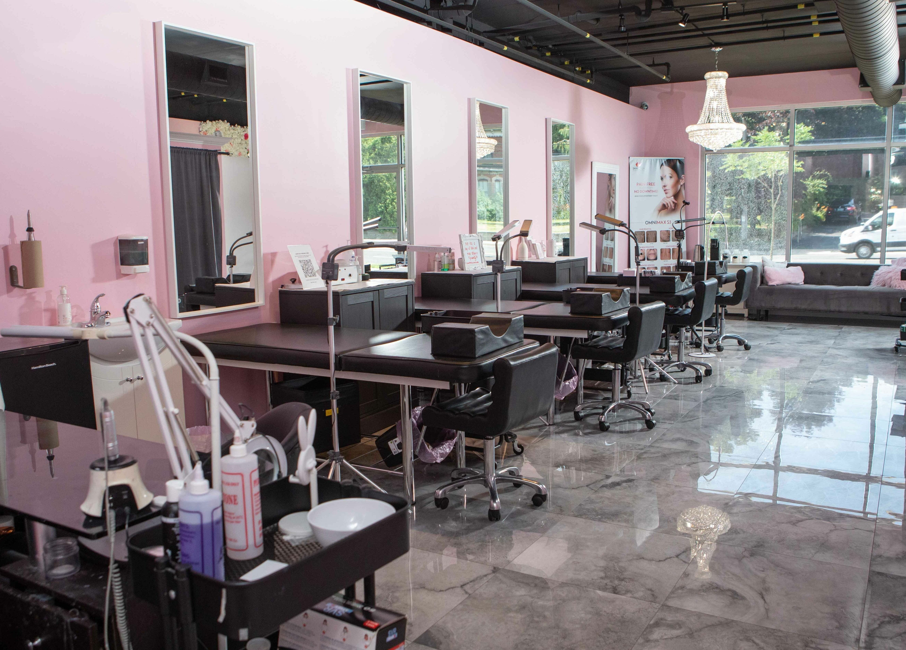 Elva Medical Aesthetics, Stoney Creek interior with pink walls and beauty stations in Hamilton, Ontario, CA.