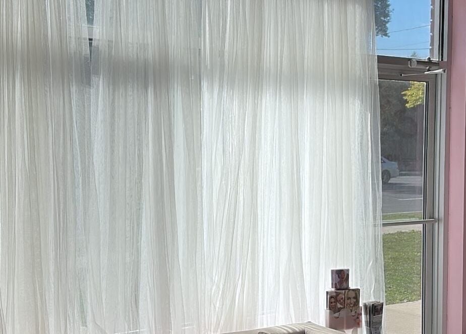 Bright window with sheer curtains at Elva Medical Aesthetics, Caledonia, Ontario, CA.