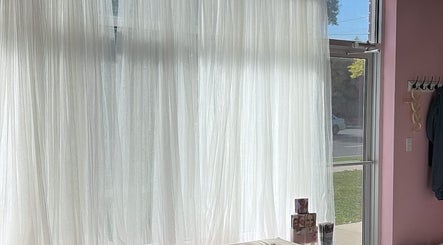 Bright window with sheer curtains at Elva Medical Aesthetics, Caledonia, Ontario, CA.