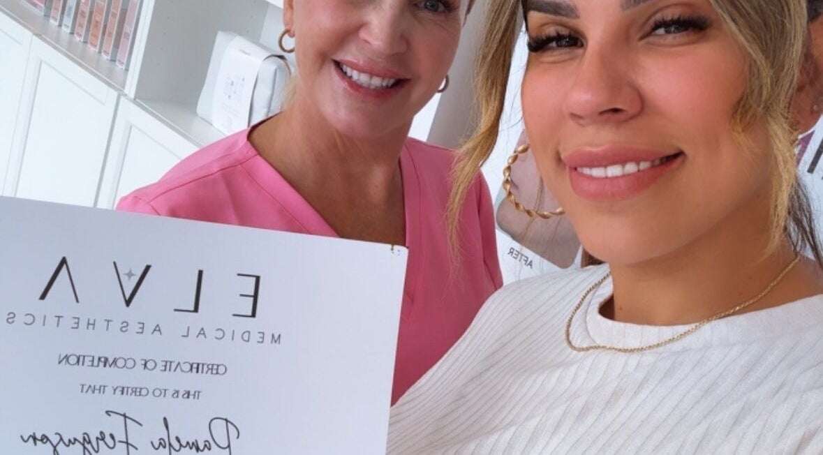 Happy Elva Medical Aesthetics clients holding a certificate at Caledonia, Ontario, CA.