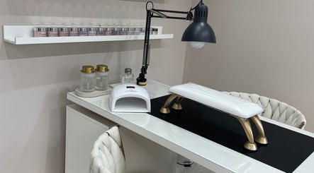 Modern nail station at 11:11 Studios, Leicester, England, GB features lamp and organized shelves.
