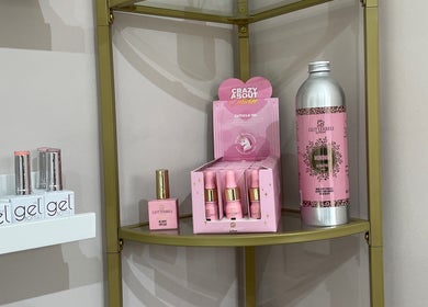 Beauty products at 11:11 Studios, Leicester, England, GB, featuring chic nail care items on elegant shelves.