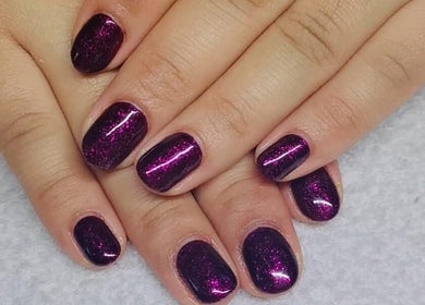 Stylish purple glitter nails at Beauty Home Spa, Saskatoon, Saskatchewan, CA, exclusive for ladies.