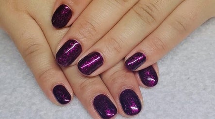 Stylish purple glitter nails at Beauty Home Spa, Saskatoon, Saskatchewan, CA, exclusive for ladies.