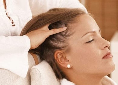 Woman enjoys a head massage at Beauty Home Spa, Saskatoon, Saskatchewan, CA. Exclusive for ladies.