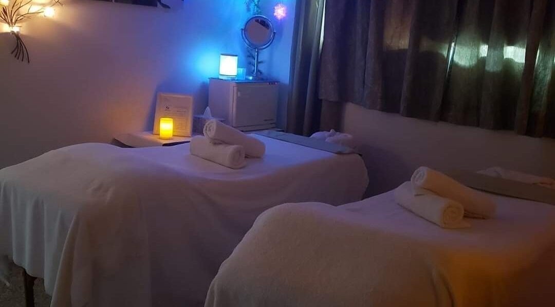 Relaxing setup at Beauty Home Spa in Saskatoon, Saskatchewan, CA with gentle lighting and cozy massage tables.