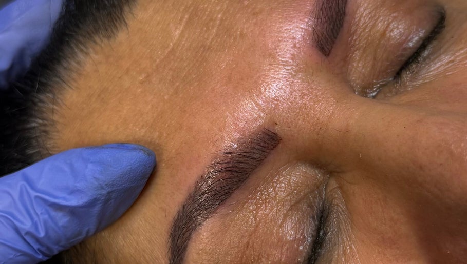 Close-up of eyebrow microblading at FNBC Salon in Leicester, England, GB, showing precise brow shaping.