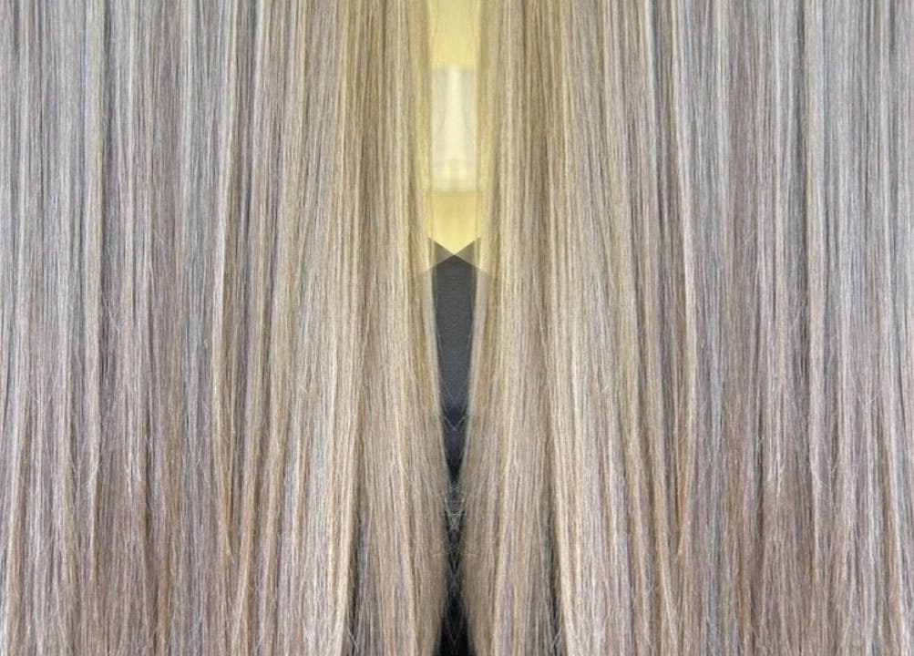 Shiny, straightened hair at FNBC Salon, Leicester, England, GB, showcasing expert styling.