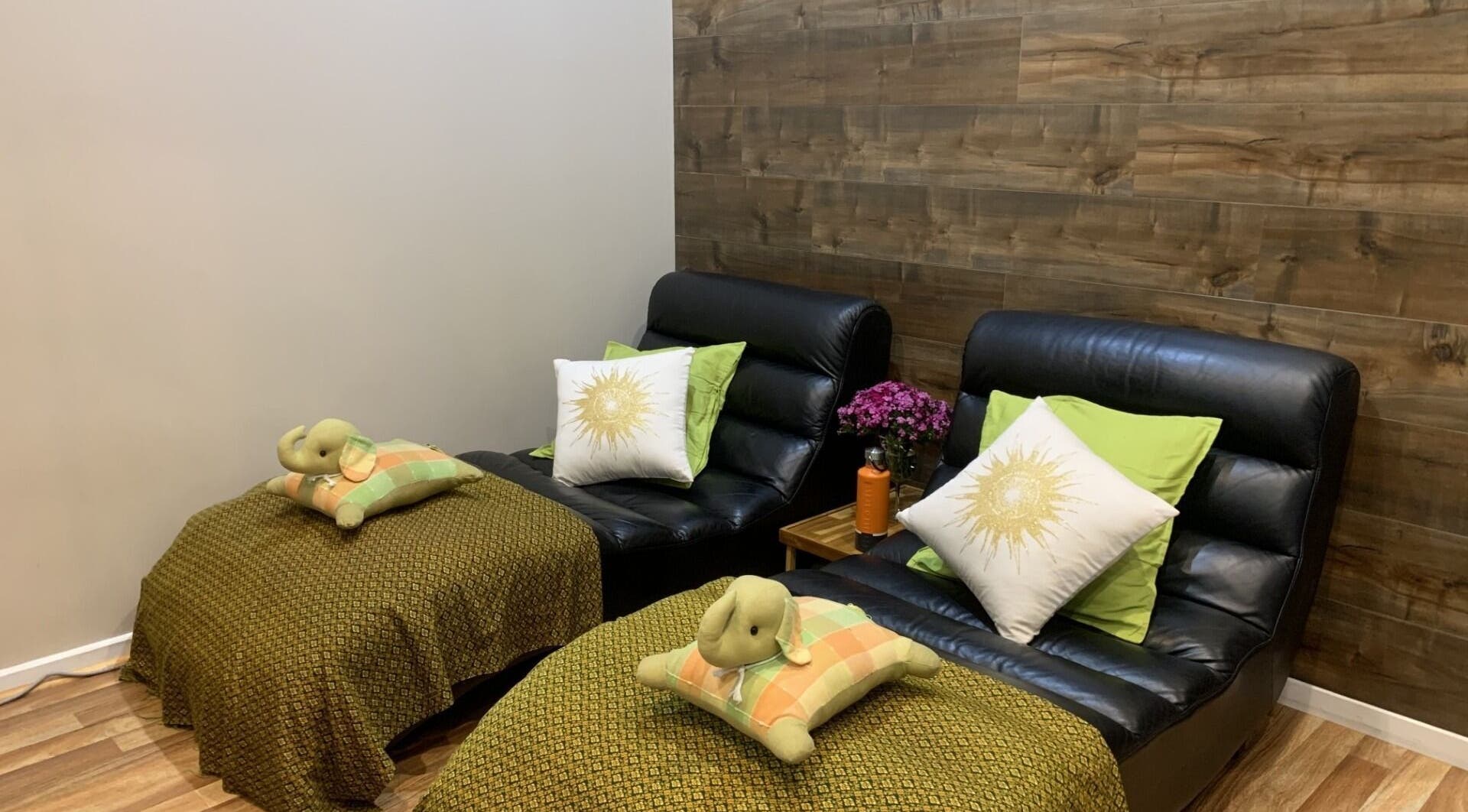 Cozy seating with cushions at Thai Take Care, Collingwood, Victoria, AU, perfect for relaxation and therapy.