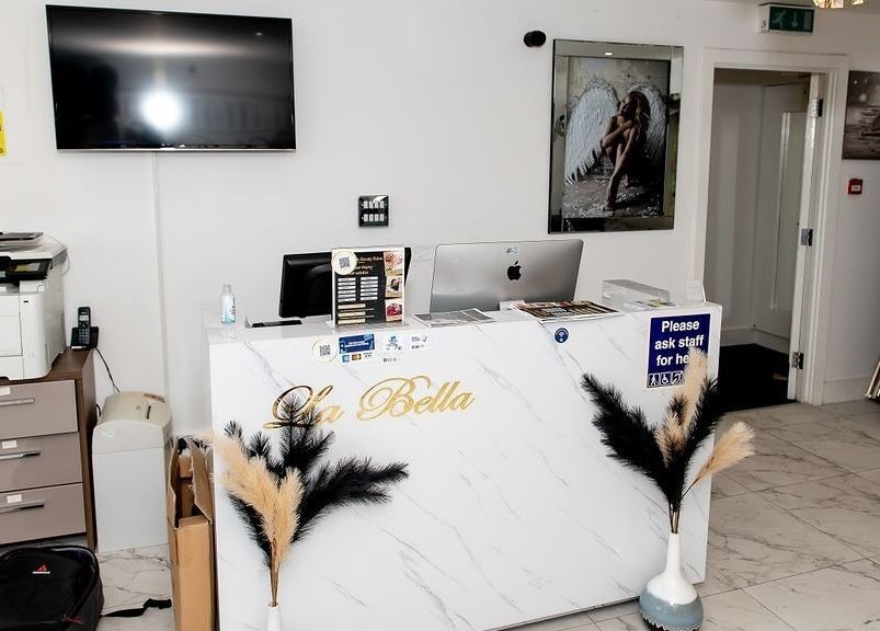Reception desk at La Bella Aesthetic Clinic in Salford, England, GB with chic decor and modern equipment.