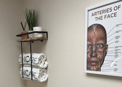 DermaLush Aesthetics in Normanton, England offers serene decor with towels and face anatomy art.