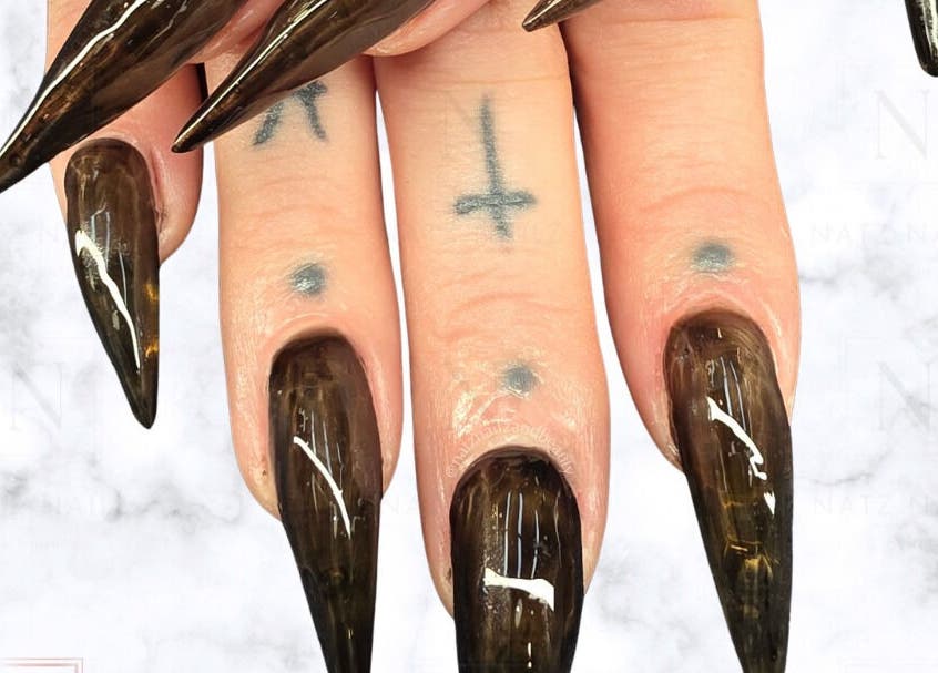 Gothic stiletto nails at Natz Nailz and Beauty, Parkwood, Queensland, AU, featuring dark, glossy nail design.