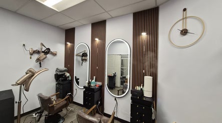 Modern styling chairs and mirrors at One Hair, La Habra, California, US in a chic beauty setting.