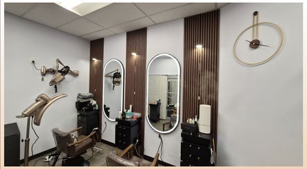 Elegant salon interior at One Hair in La Habra, California, US featuring modern mirrors and styling chairs.