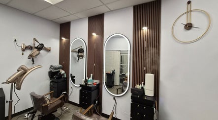 Modern salon interior at One Hair, La Habra, California, US, with sleek styling stations and decor.