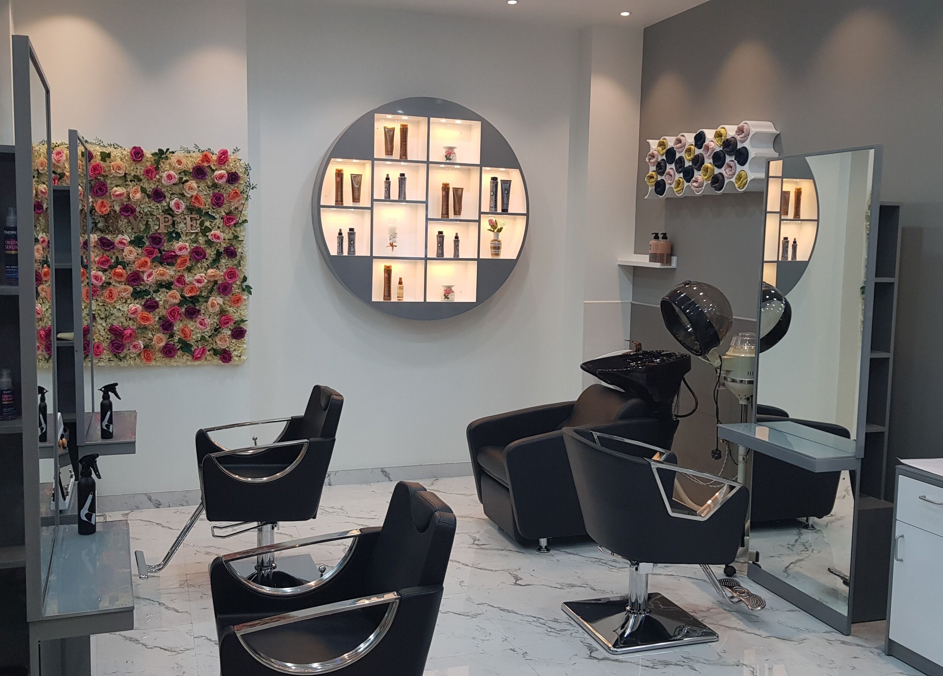 Elegant interior of Hype Ladies Salon - Al Nahda Branch in Al Nahda, Dubai, AE with stylish chairs and decor.