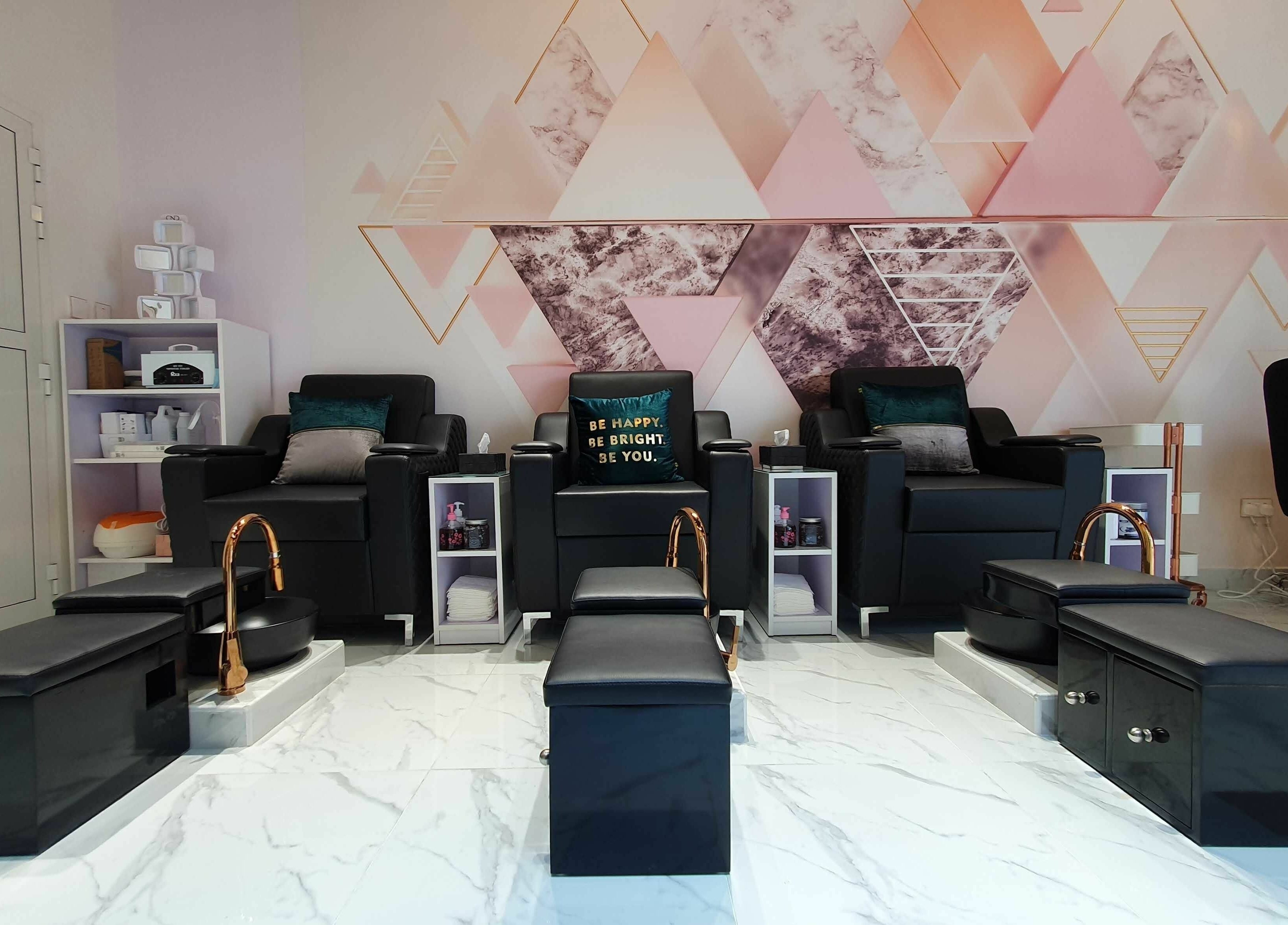 Luxury pedicure chairs at Hype Ladies Salon - Majan Branch, Dubai, AE with geometric wall design.