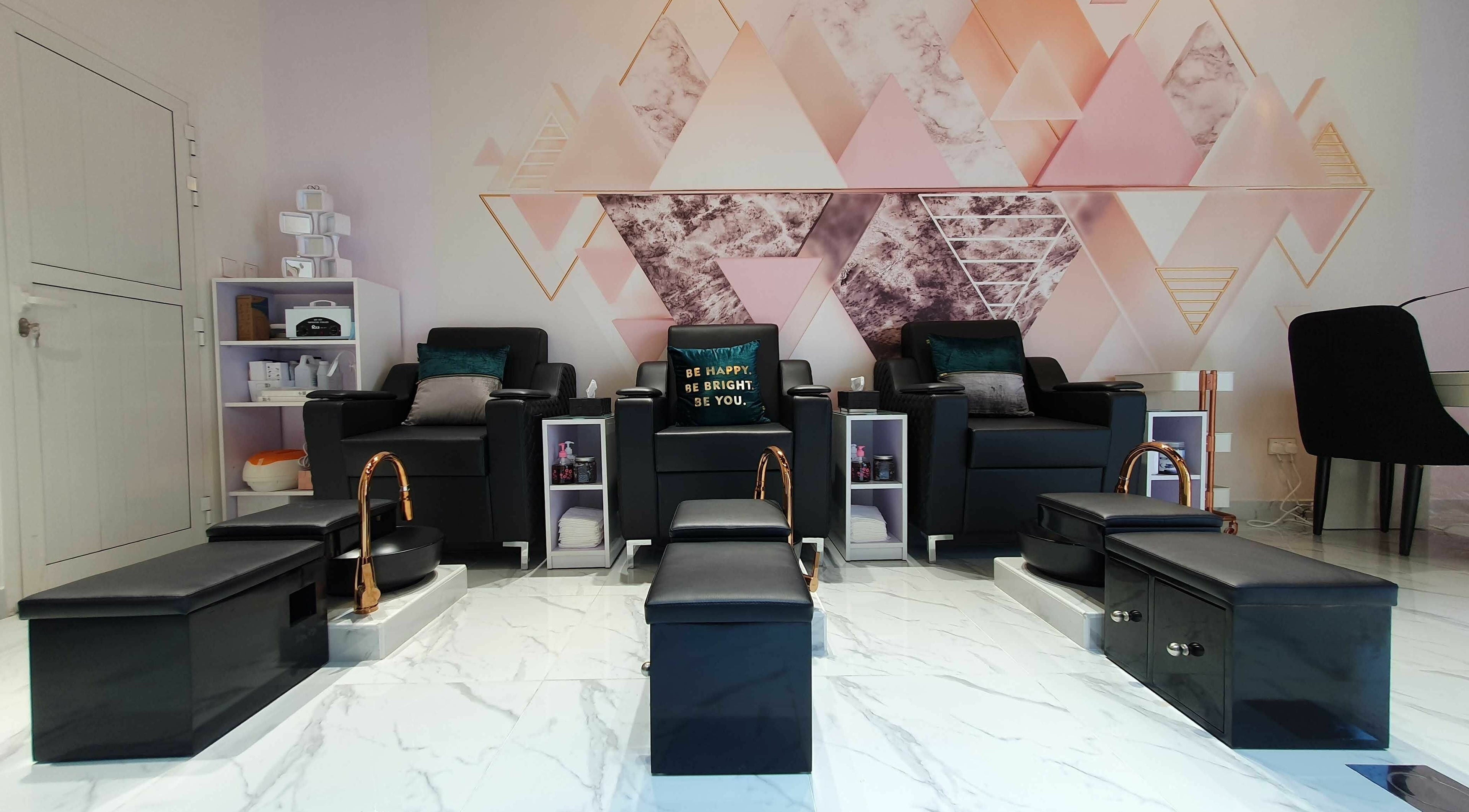 Luxury pedicure chairs at Hype Ladies Salon - Majan Branch, Dubai, AE with geometric wall design.