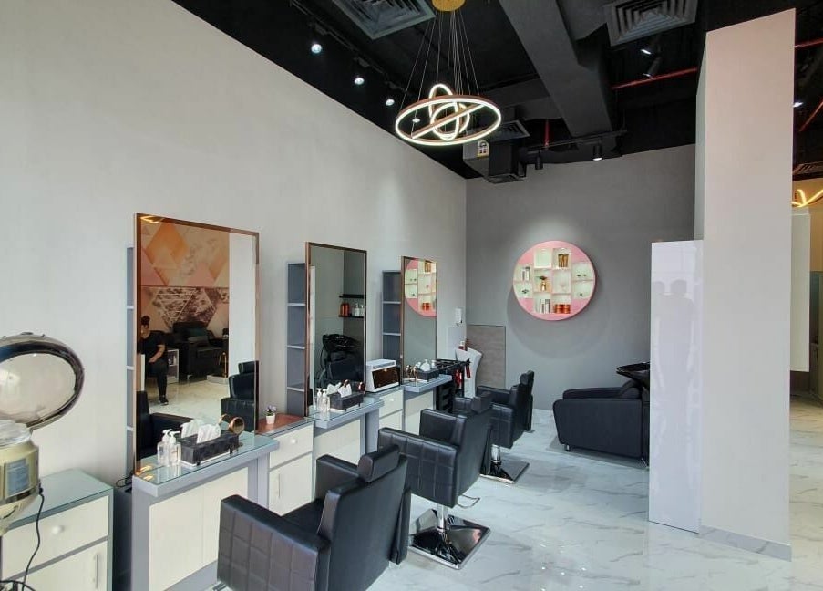 Modern salon interior at Hype Ladies Salon - Majan Branch, Dubai, AE, featuring sleek styling stations.