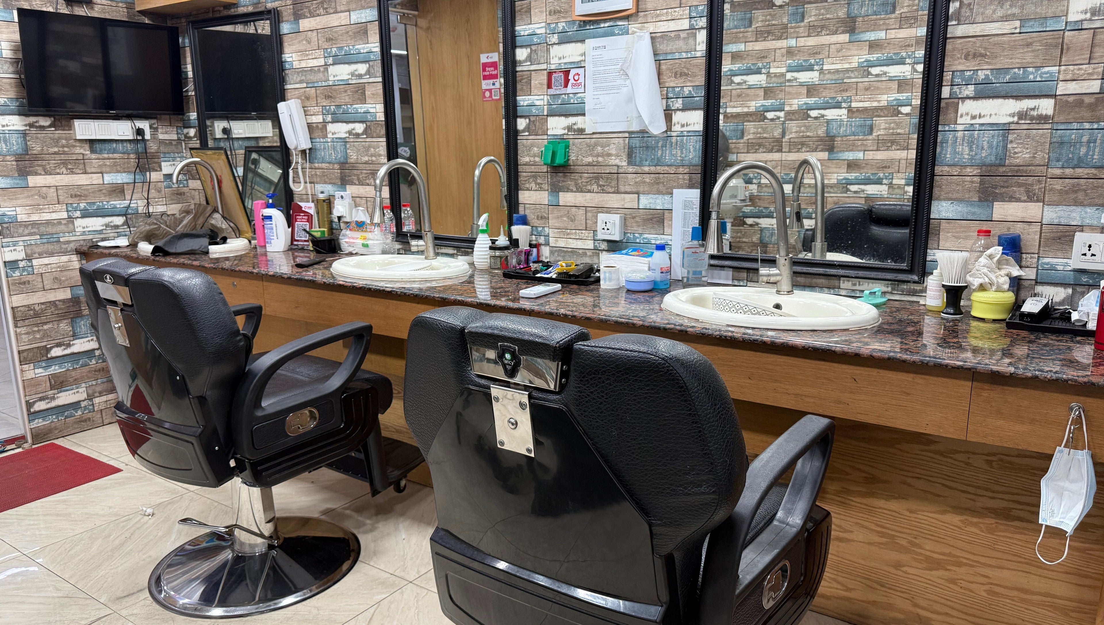 Modern styling chairs and mirrors at Trendy Trim, Dhaka, Dhaka Division, BD, showcasing a sleek salon interior.