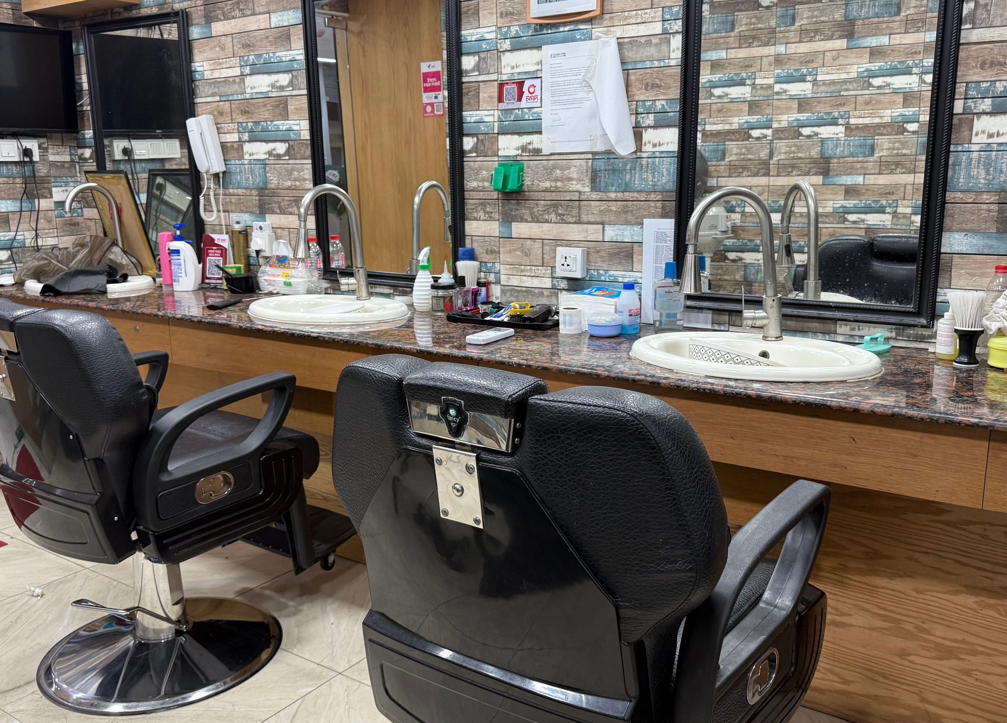 Modern styling chairs and mirrors at Trendy Trim, Dhaka, Dhaka Division, BD, showcasing a sleek salon interior.