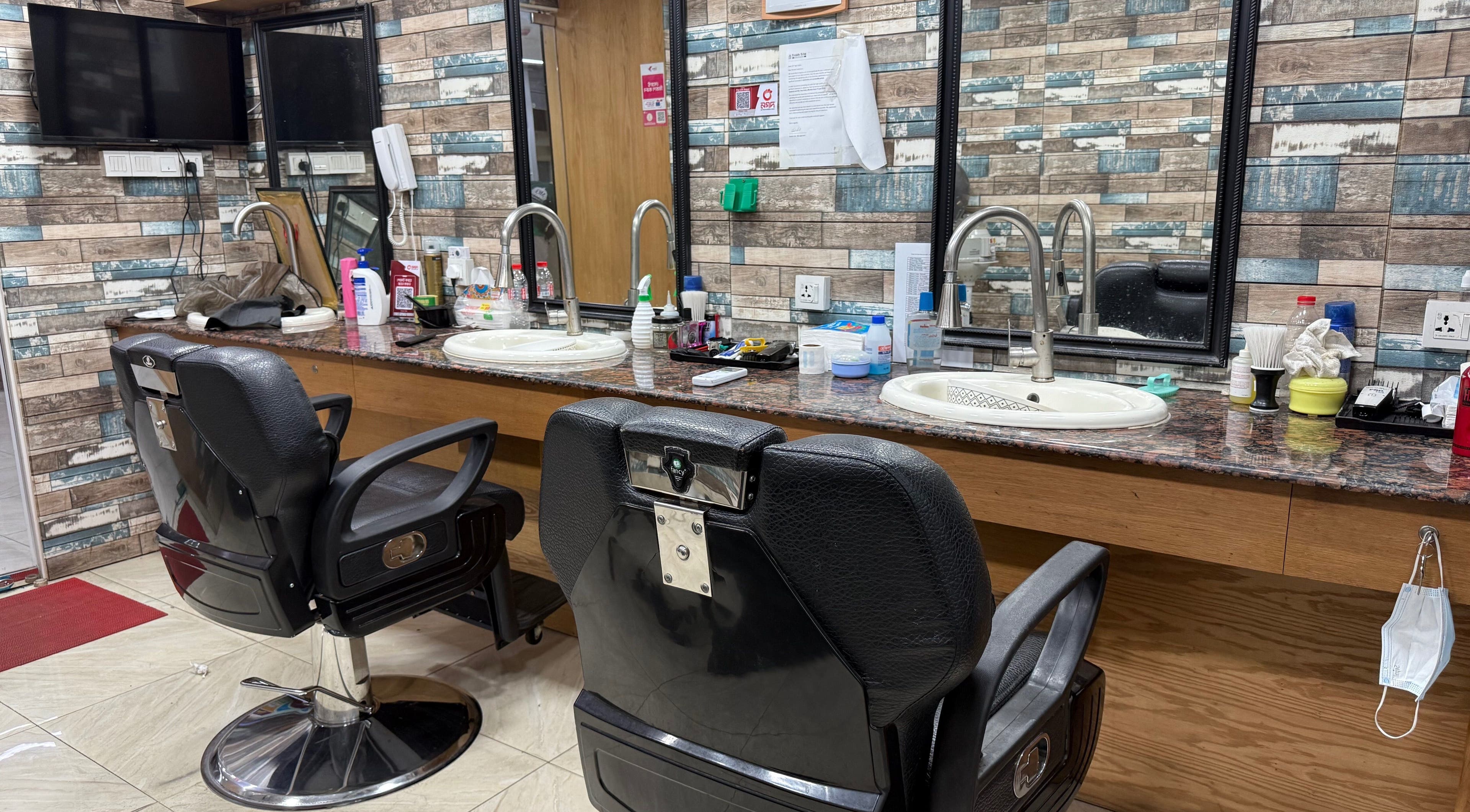 Modern styling chairs and mirrors at Trendy Trim, Dhaka, Dhaka Division, BD, showcasing a sleek salon interior.