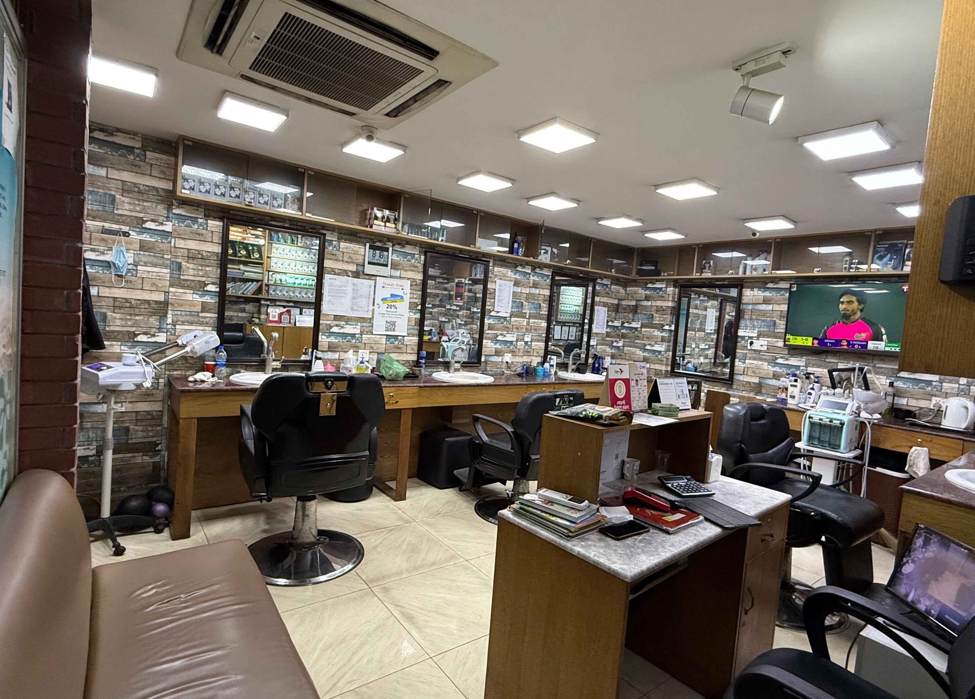 Modern salon interior at Trendy Trim in Dhaka, Dhaka Division, BD, featuring stylish chairs and decor.