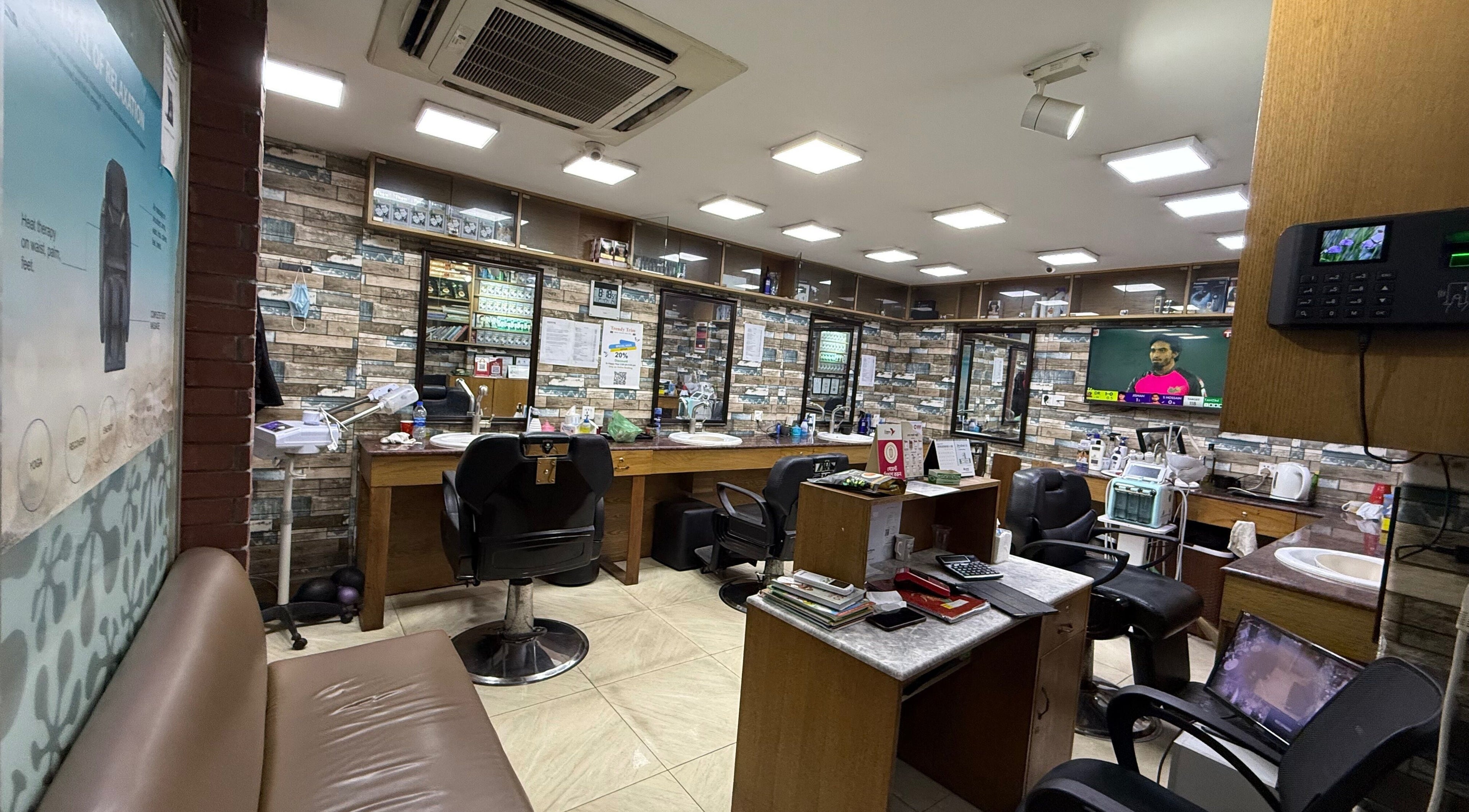 Modern salon interior at Trendy Trim in Dhaka, Dhaka Division, BD, featuring stylish chairs and decor.