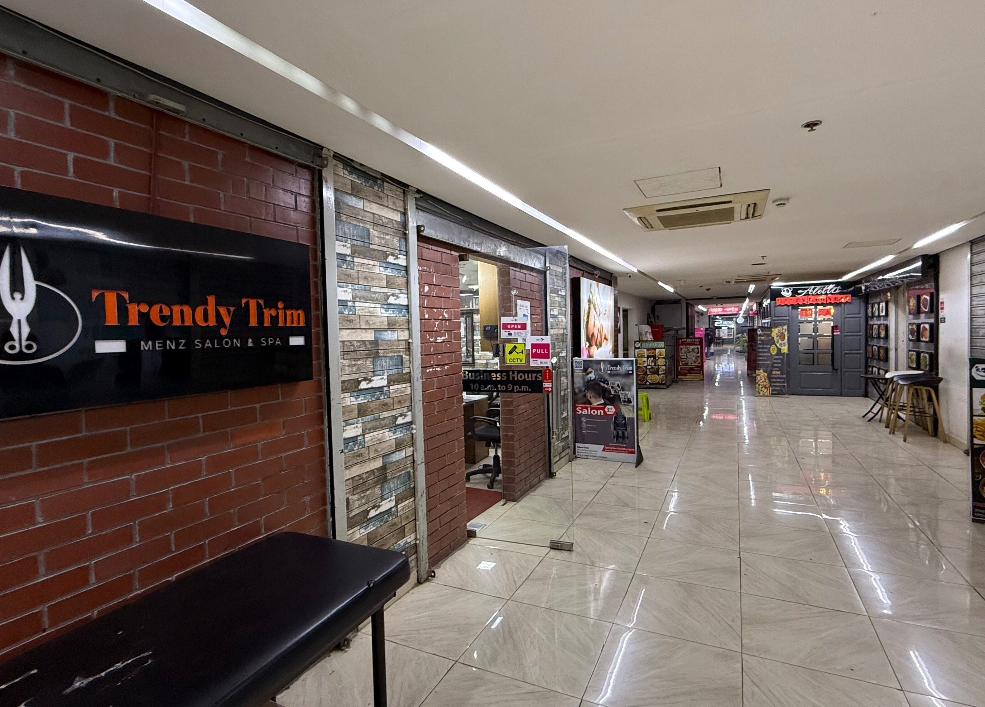Entrance of Trendy Trim salon showcasing signage in Dhaka, Dhaka Division, BD.