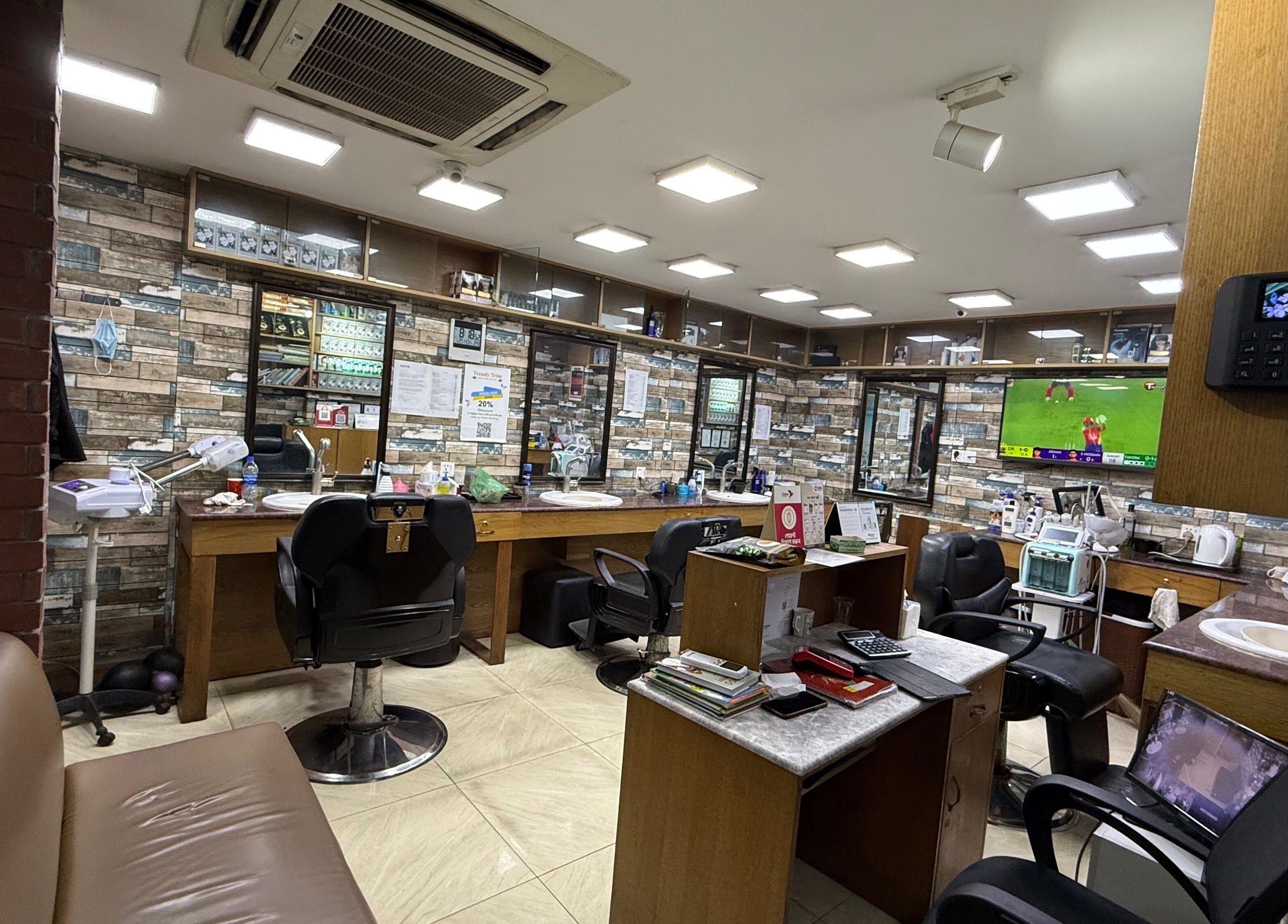 Stylish beauty room at Trendy Trim in Dhaka, Dhaka Division, BD with modern chairs and decor.