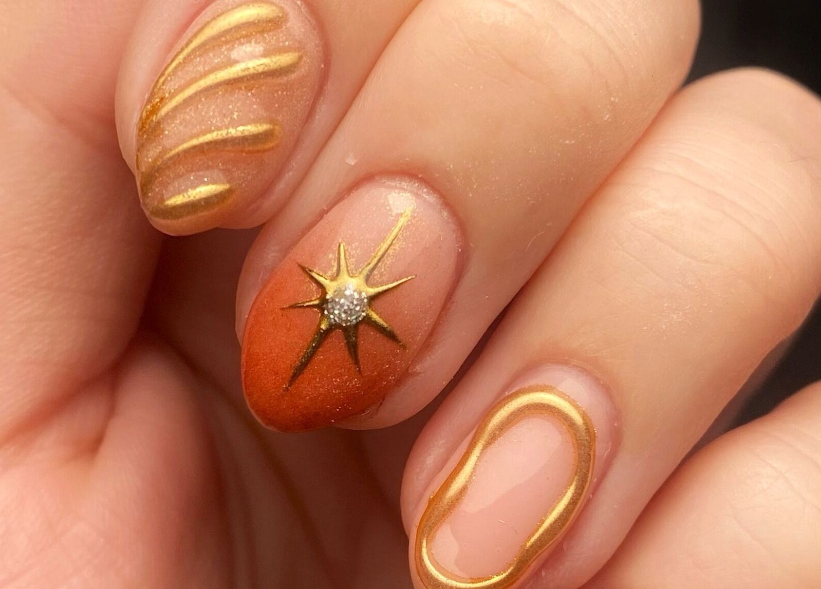 Elegant gold manicure at No Filter aesthetics and beauty, Aylesbury, England, GB, showcasing intricate nail art.