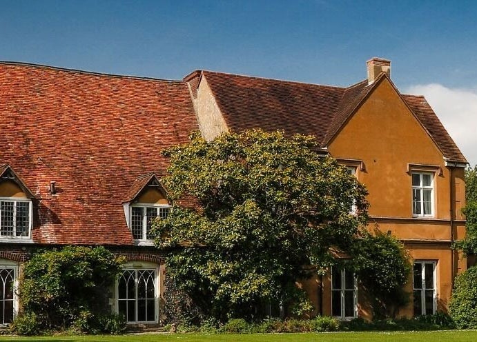 Historic building of NC Wellbeing in Meopham, England, GB surrounded by lush greenery.
