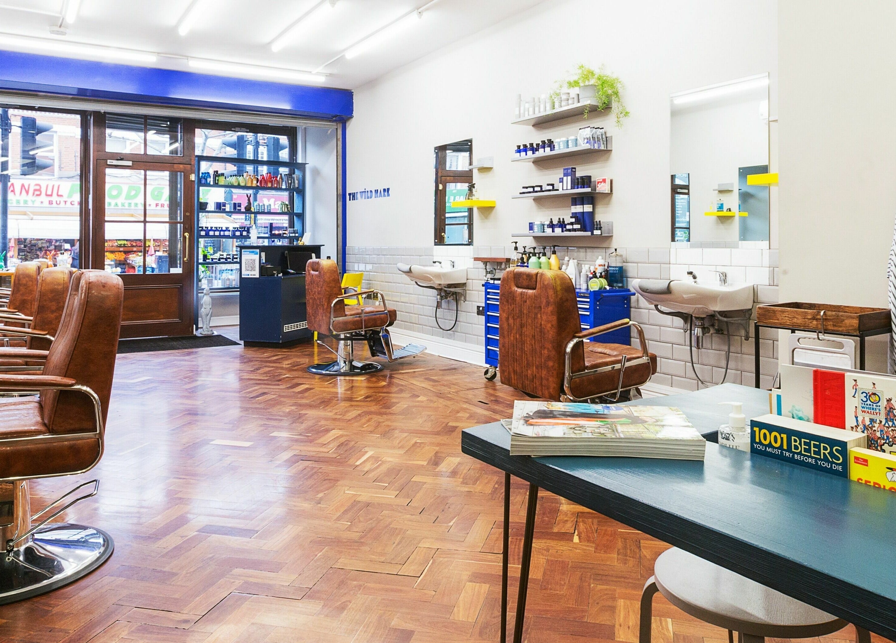 Modern salon interior at The Wild Hare, London, England, GB with sleek design and leather chairs.