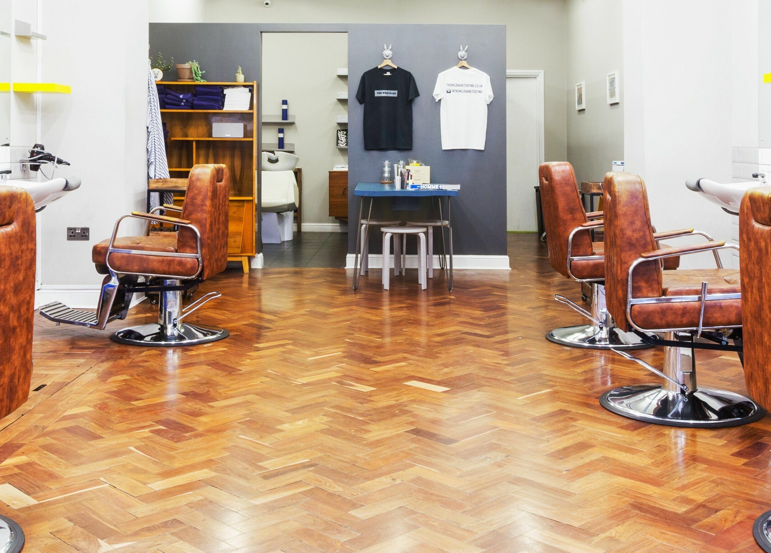 Elegant salon chairs at The Wild Hare in London, England, GB, showcasing a stylish and modern beauty venue.
