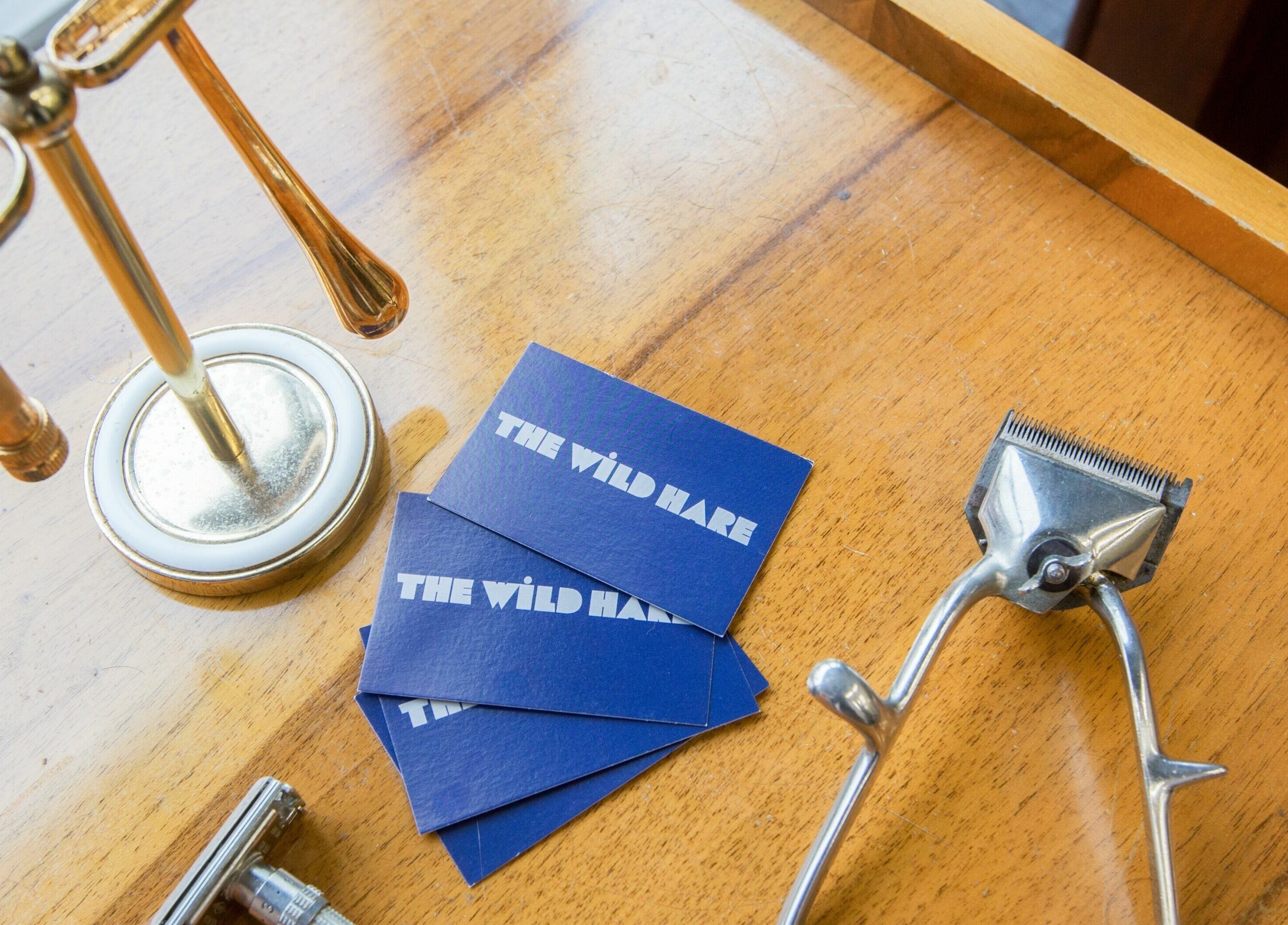Grooming tools at The Wild Hare, London, England, GB on a wooden table showcasing vintage elegance.