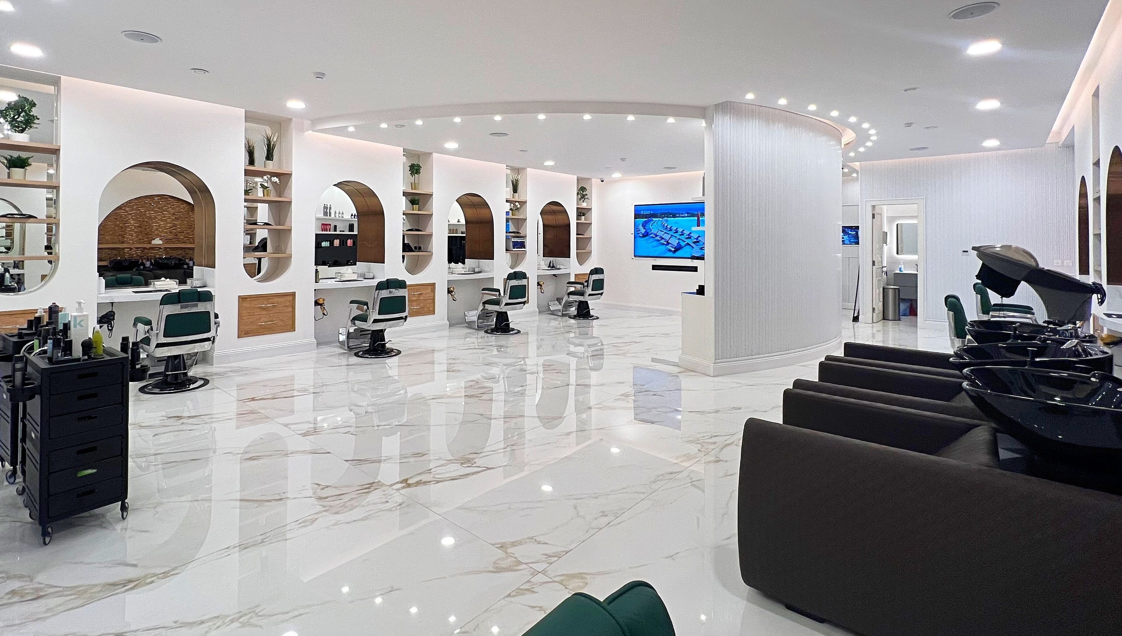 Modern interior of Vogue Icon for Men in Riyadh, Riyadh Province, SA showcasing sleek salon stations.