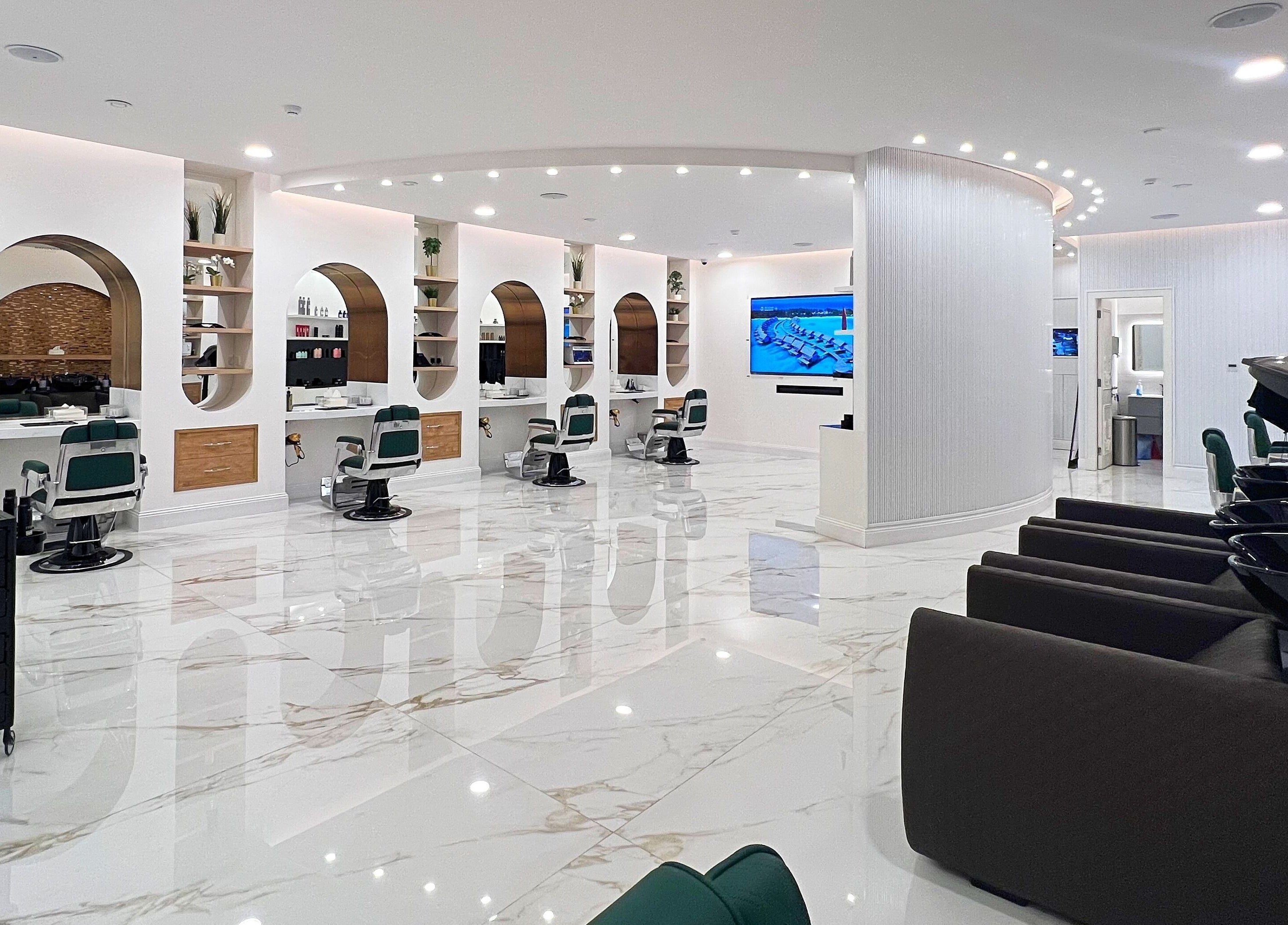 Modern interior of Vogue Icon for Men in Riyadh, Riyadh Province, SA showcasing sleek salon stations.