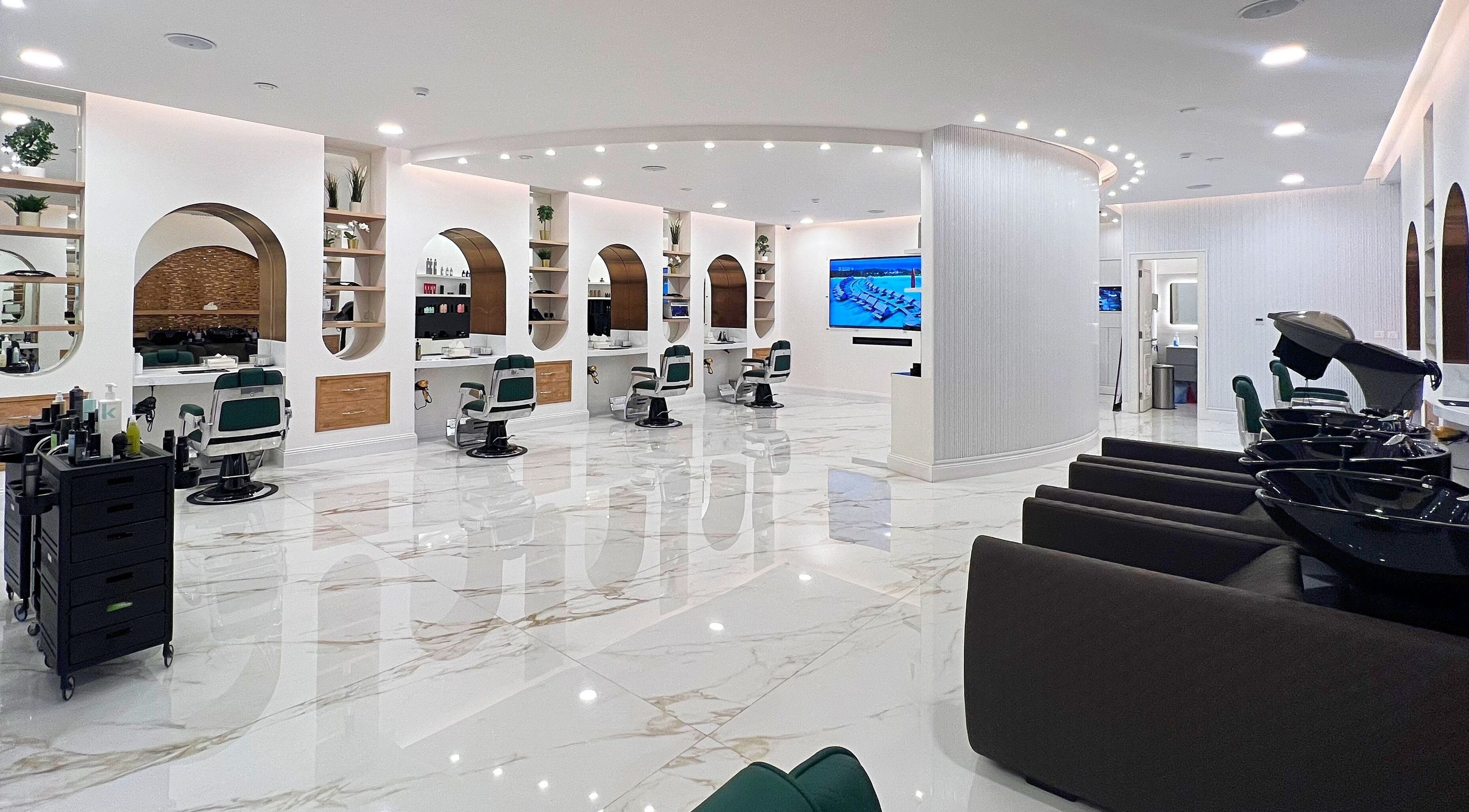 Modern interior of Vogue Icon for Men in Riyadh, Riyadh Province, SA showcasing sleek salon stations.