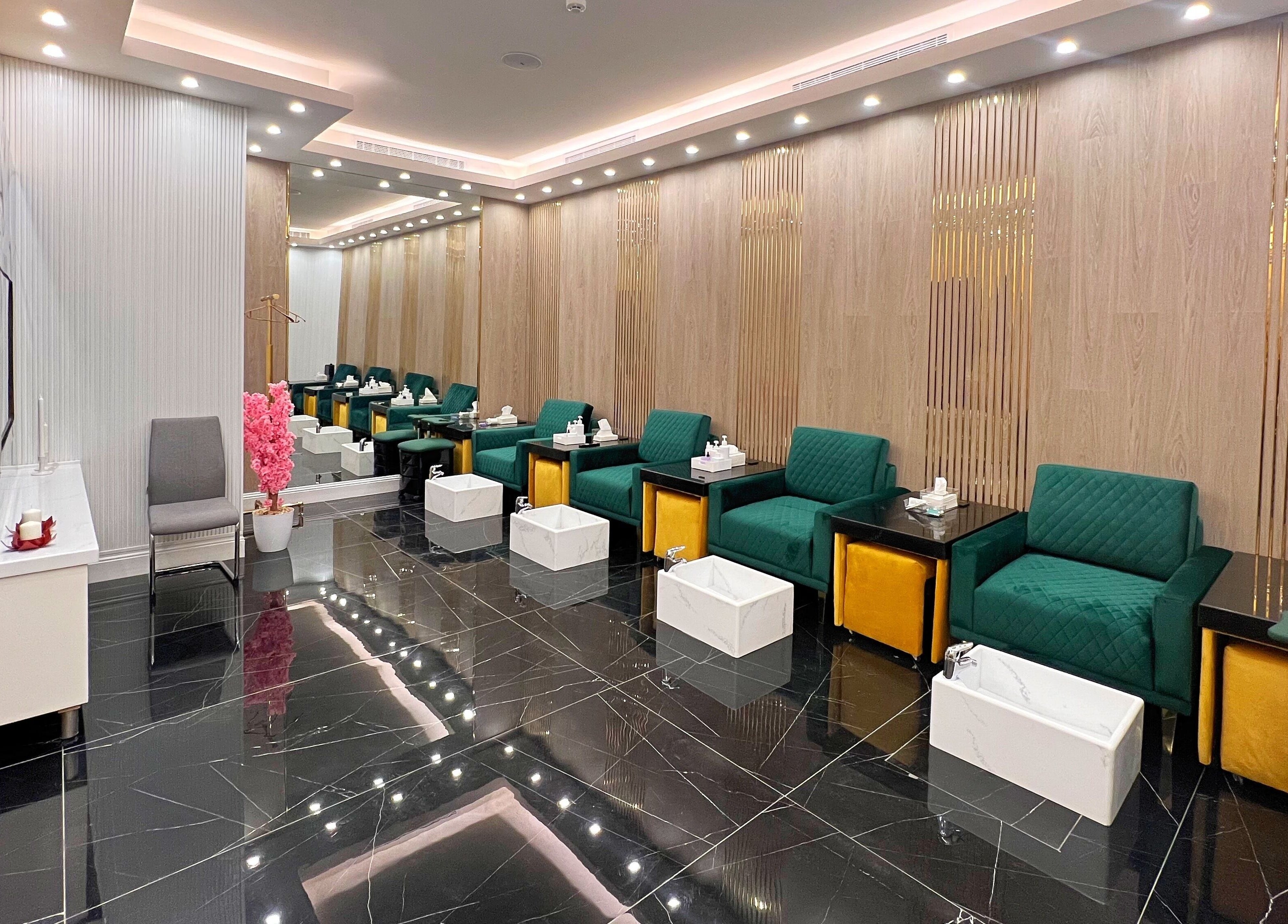 Luxurious waiting area at Vogue Icon for Men, Riyadh, Riyadh Province, SA featuring plush seating and modern decor.