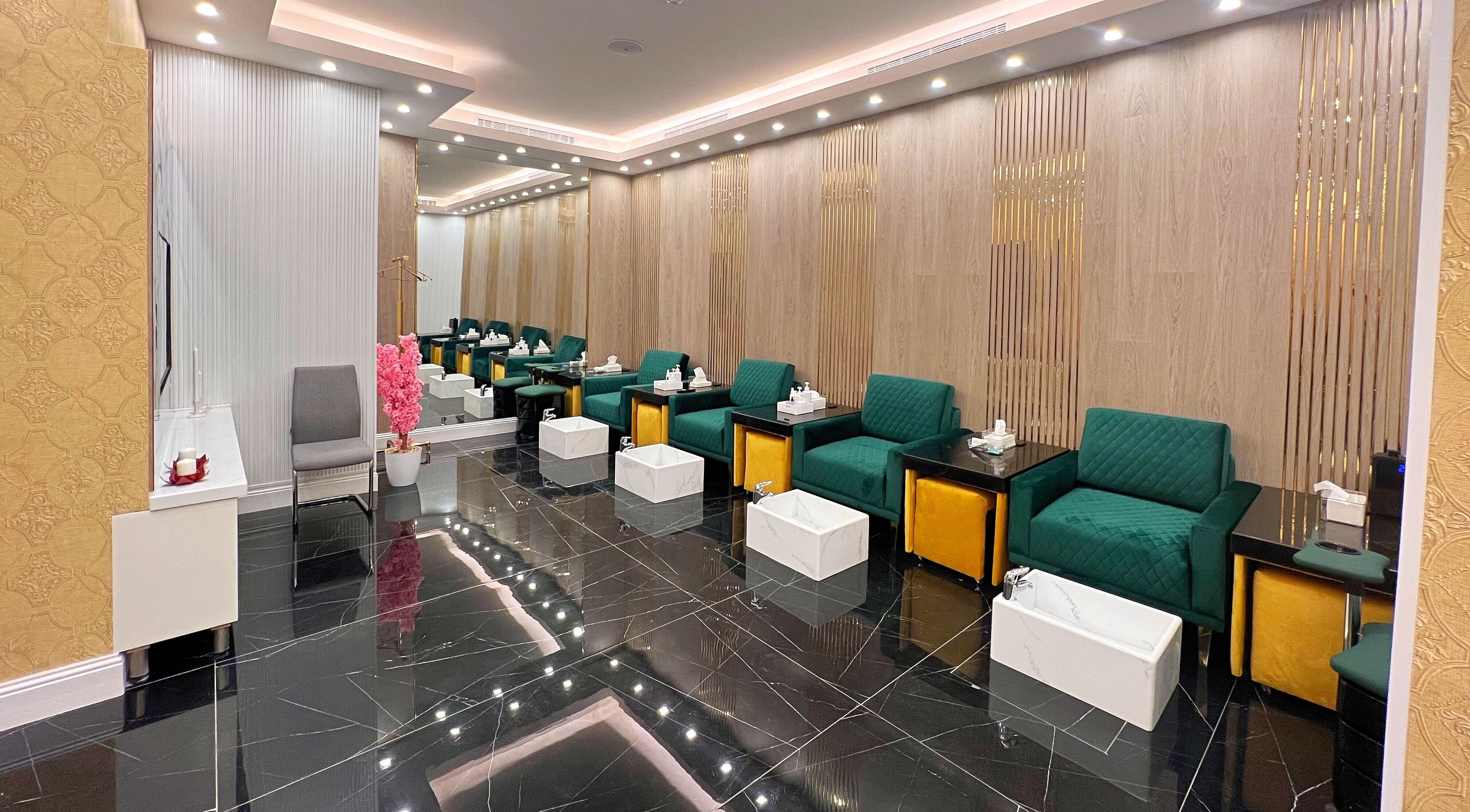 Luxurious waiting area at Vogue Icon for Men, Riyadh, Riyadh Province, SA featuring plush seating and modern decor.
