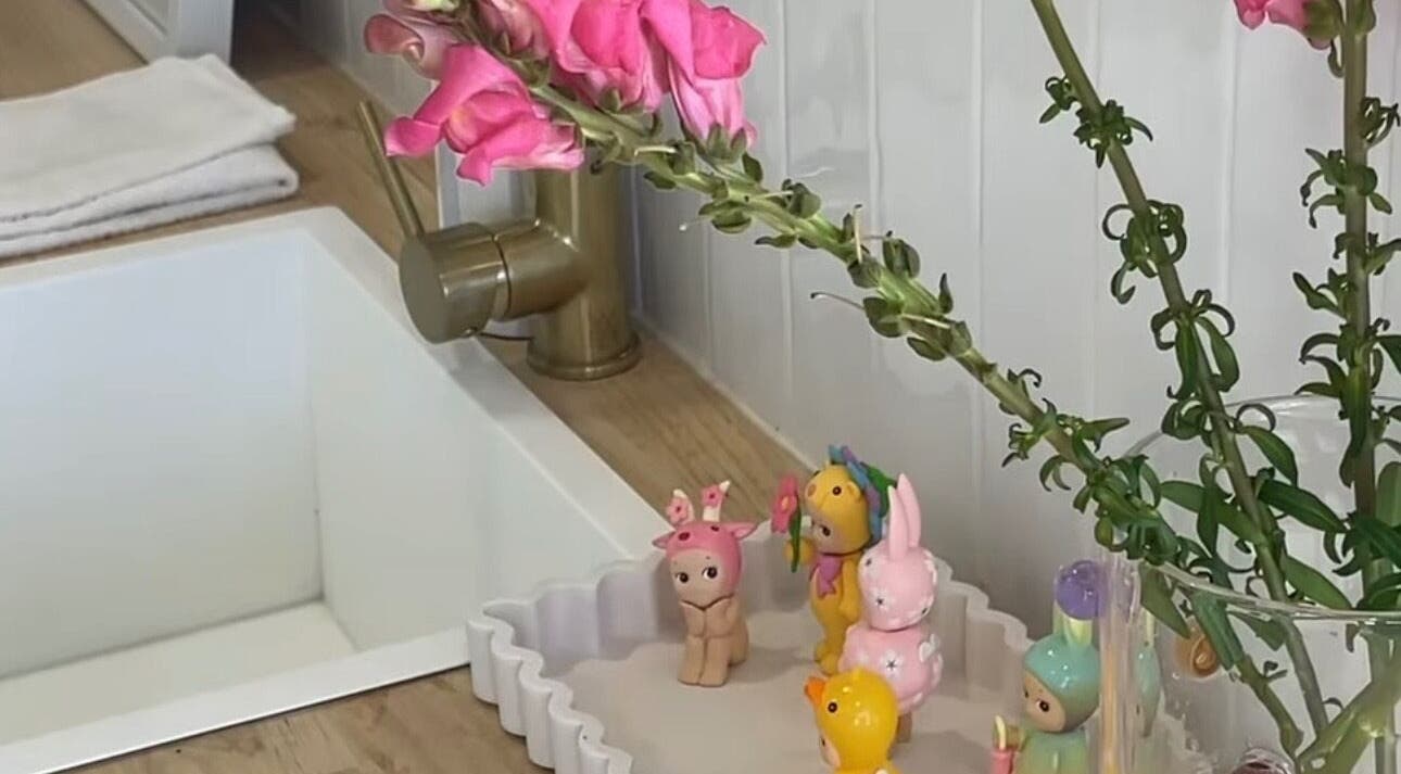 Elegant vanity with pink flowers and figurines at The Gel Bar, Currumbin Waters, Queensland, AU.