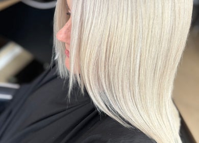 Expertly styled blonde hair at Laura Waterworth Hair, Dunmurry, Northern Ireland, GB.