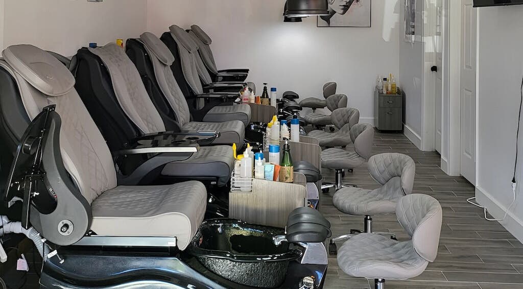 Luxurious pedicure chairs at Q Nails & Spa, Boston, Massachusetts, US, offering relaxing beauty services.
