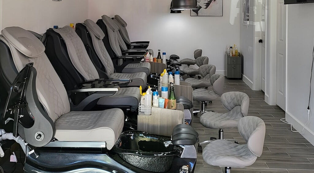 Luxurious pedicure chairs at Q Nails & Spa, Boston, Massachusetts, US, offering relaxing beauty services.