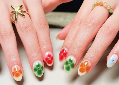 Colorful floral nail art at Madame Oh La Laa, Al Khobar, SA showcasing exquisite manicure designs.