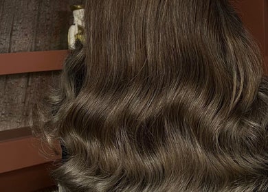 Luxurious wavy hair styled at Madame Oh La Laa, Al Khobar, SA, showcasing silky texture and elegance.