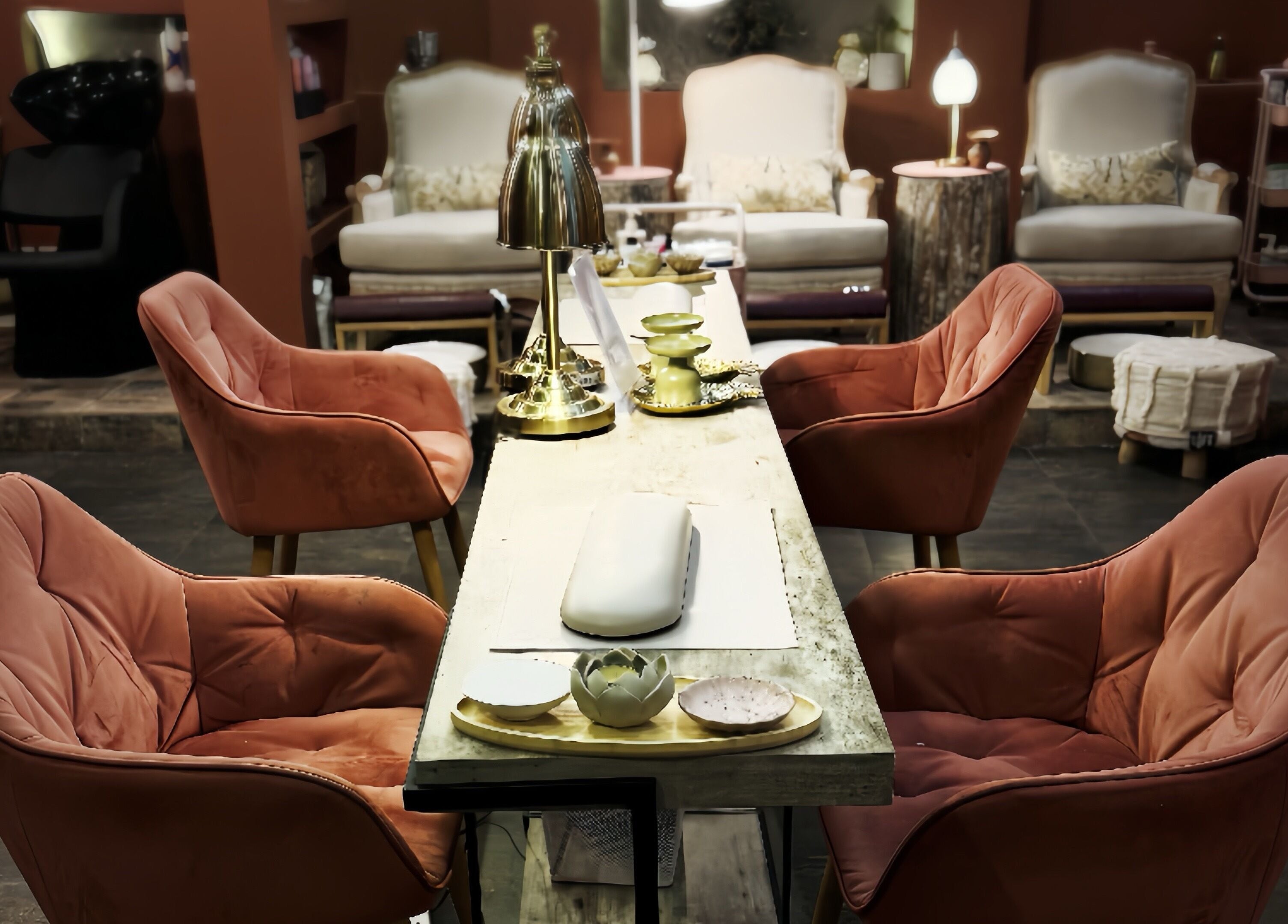 Chic seating area at Madame Oh La Laa, Al Khobar, SA, featuring plush chairs and a stylish table.