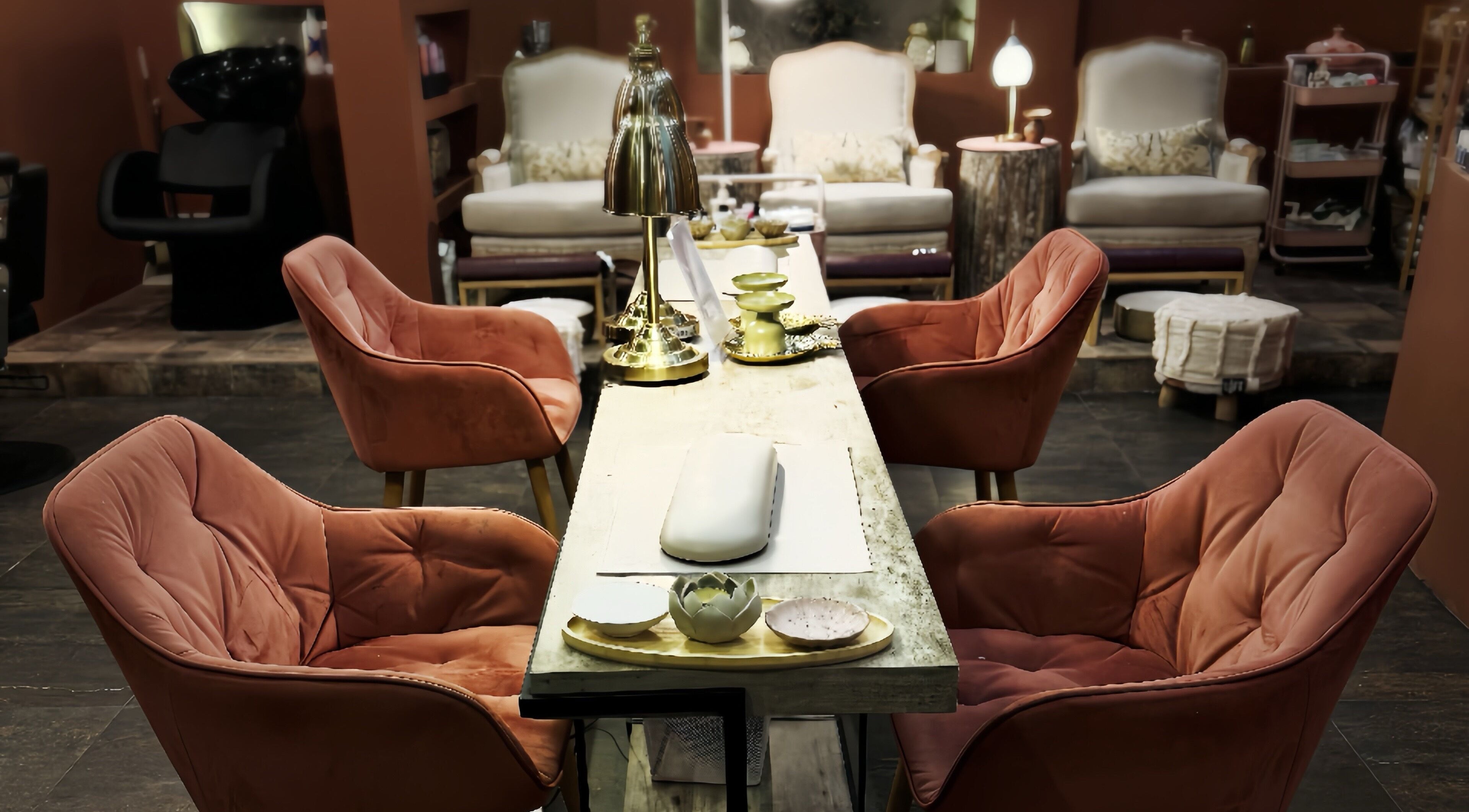 Chic seating area at Madame Oh La Laa, Al Khobar, SA, featuring plush chairs and a stylish table.